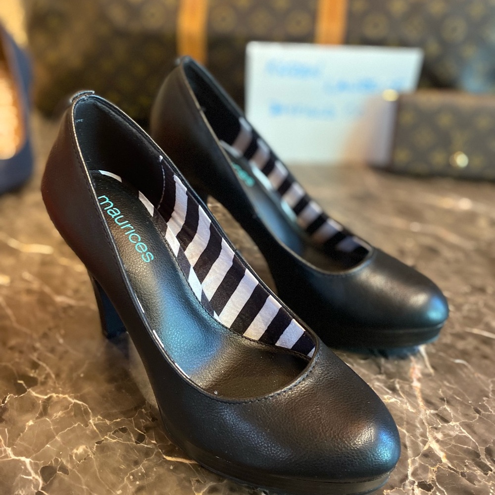 Maurice’s Black round toe pumps with black and white interior. Brand New.